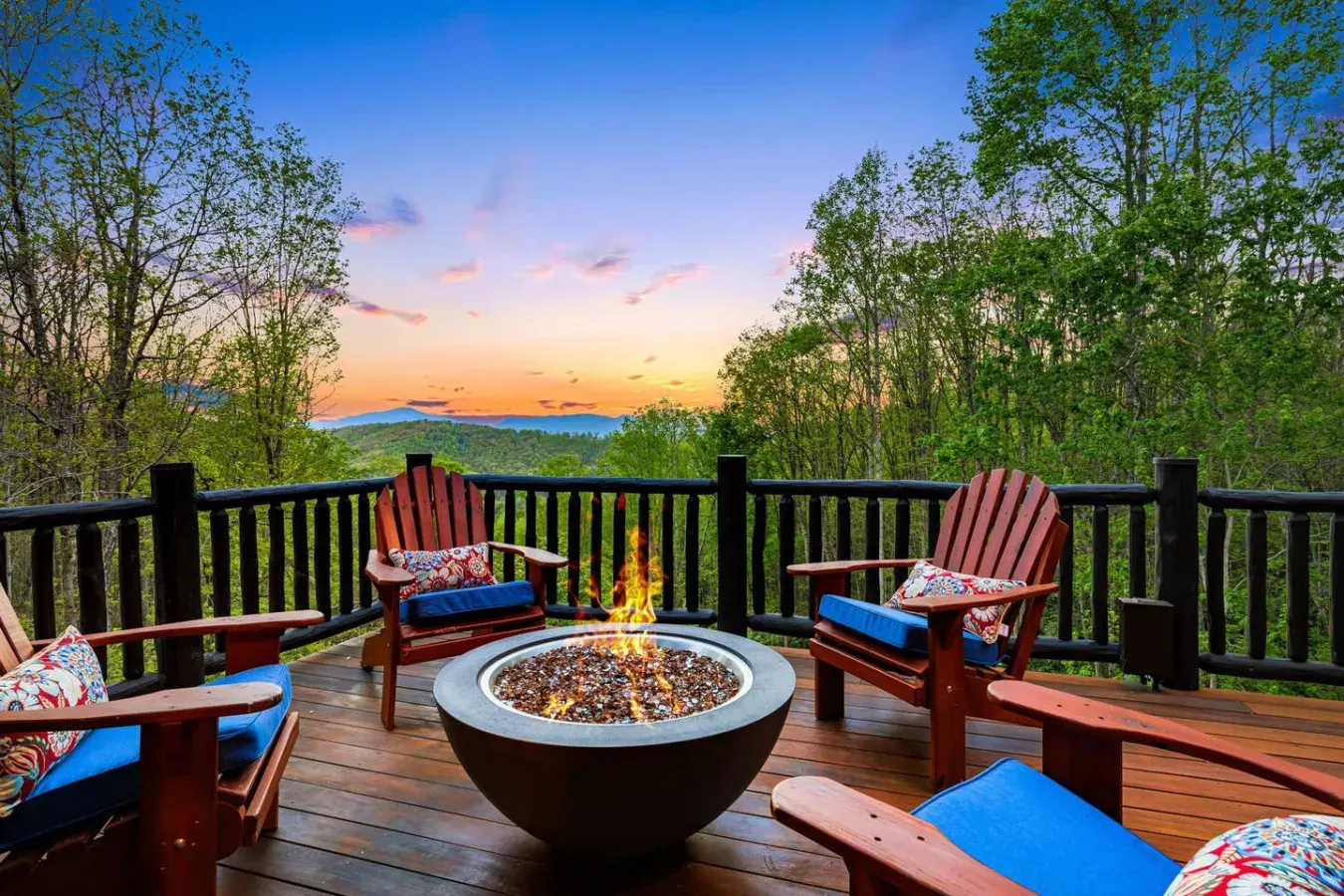 Firepit deck at East View Lodge, a Leisr Stays managed log cabin, overlooking the Blue Ridge Mountains at sunset near Asheville, North Carolina