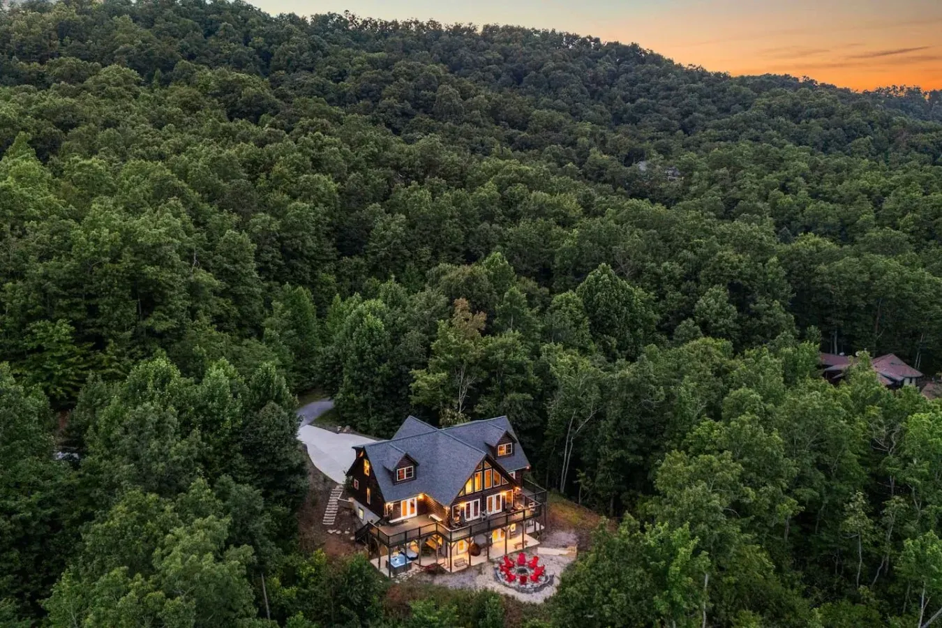 Aerial view of a Leisr Stays managed luxury cabin at sunset near Black Mountain, North Carolina
