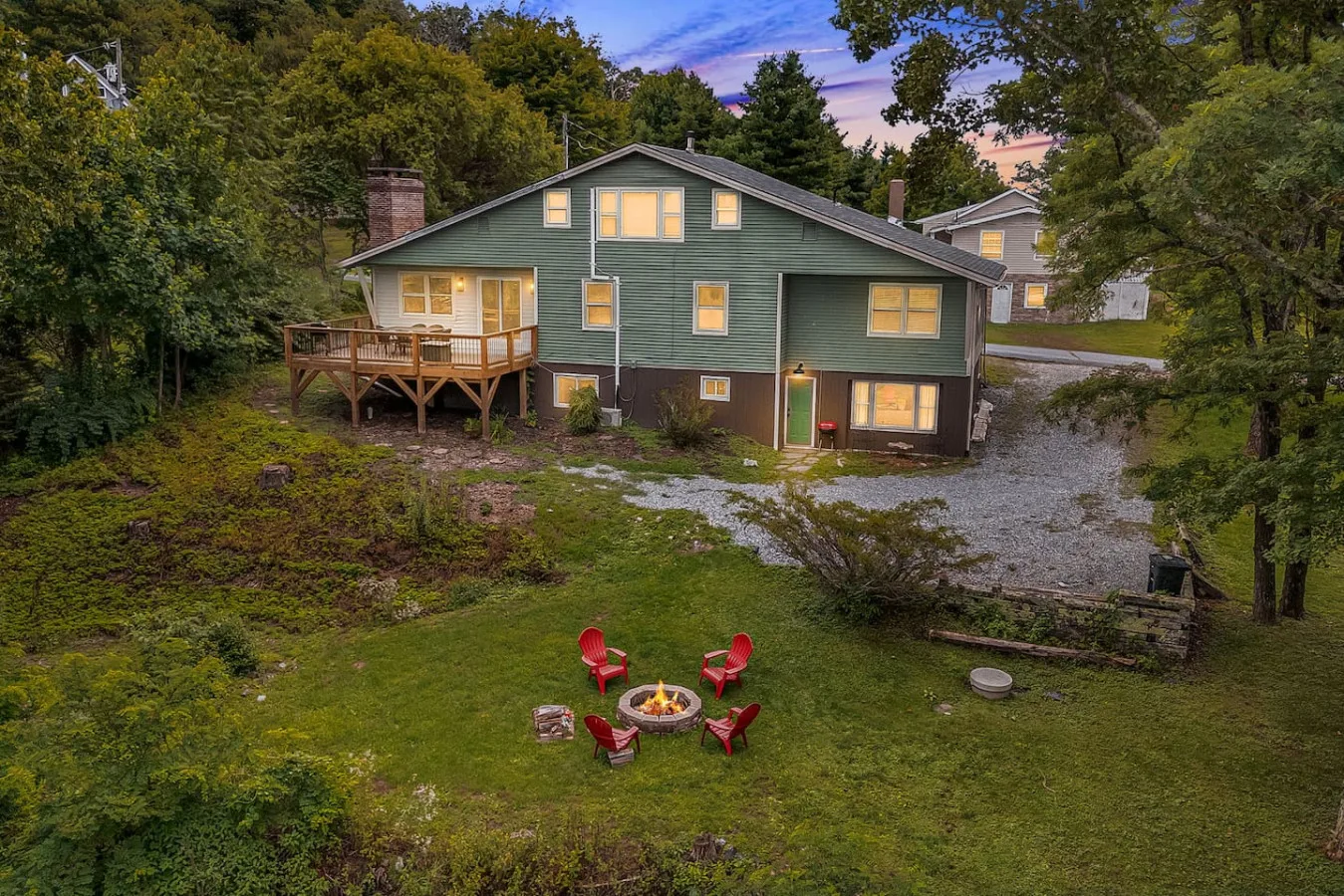 A Leisr Stays managed mountain home with a fire pit at dusk near Blowing Rock, North Carolina