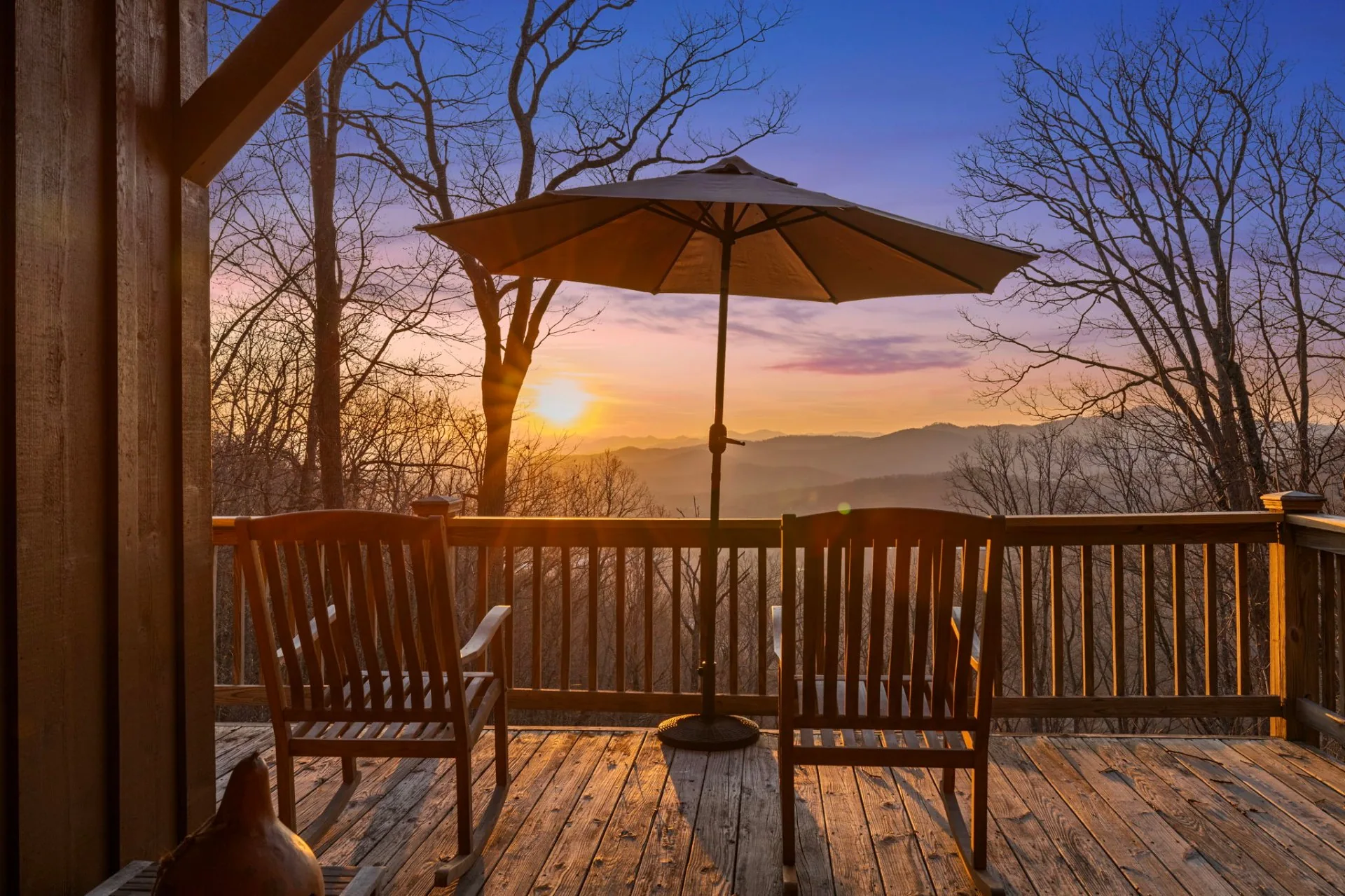 Mountain vacation rental deck at sunset near Lake Lure, North Carolina