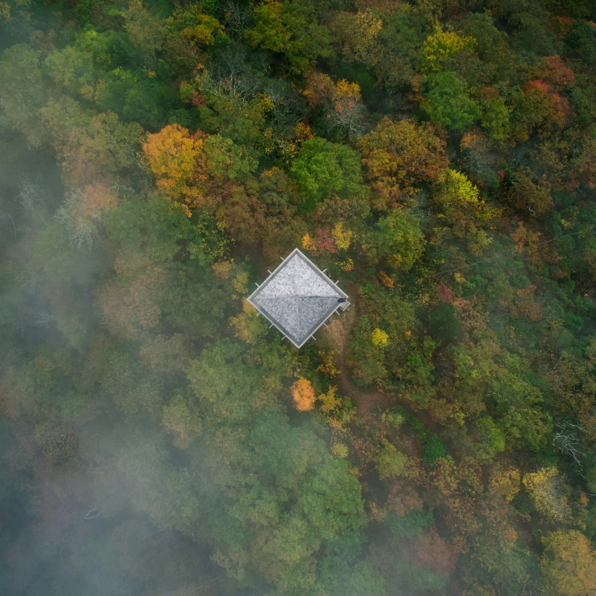 Aerial view of the Green Knob Lookout Tower in fall foliage near Old Fort, North Carolina, about 10 minutes from Marion