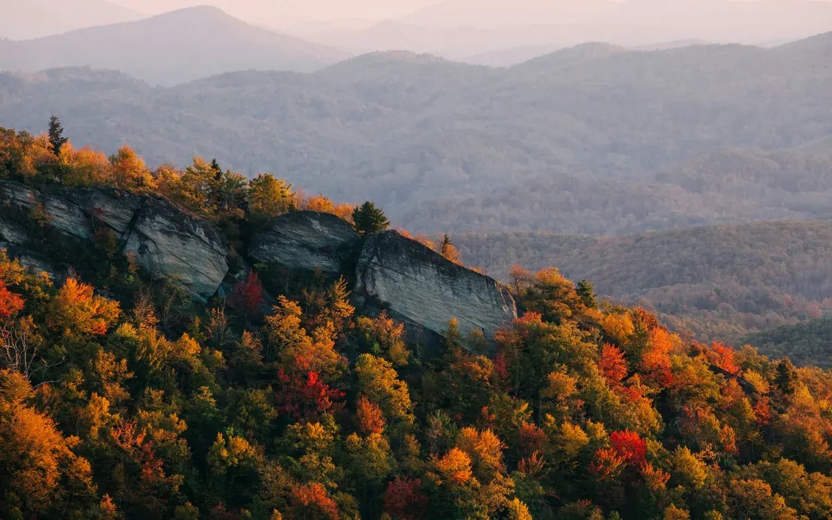 Rocky overlook above fall foliage in North Carolina's Blue Ridge Mountains