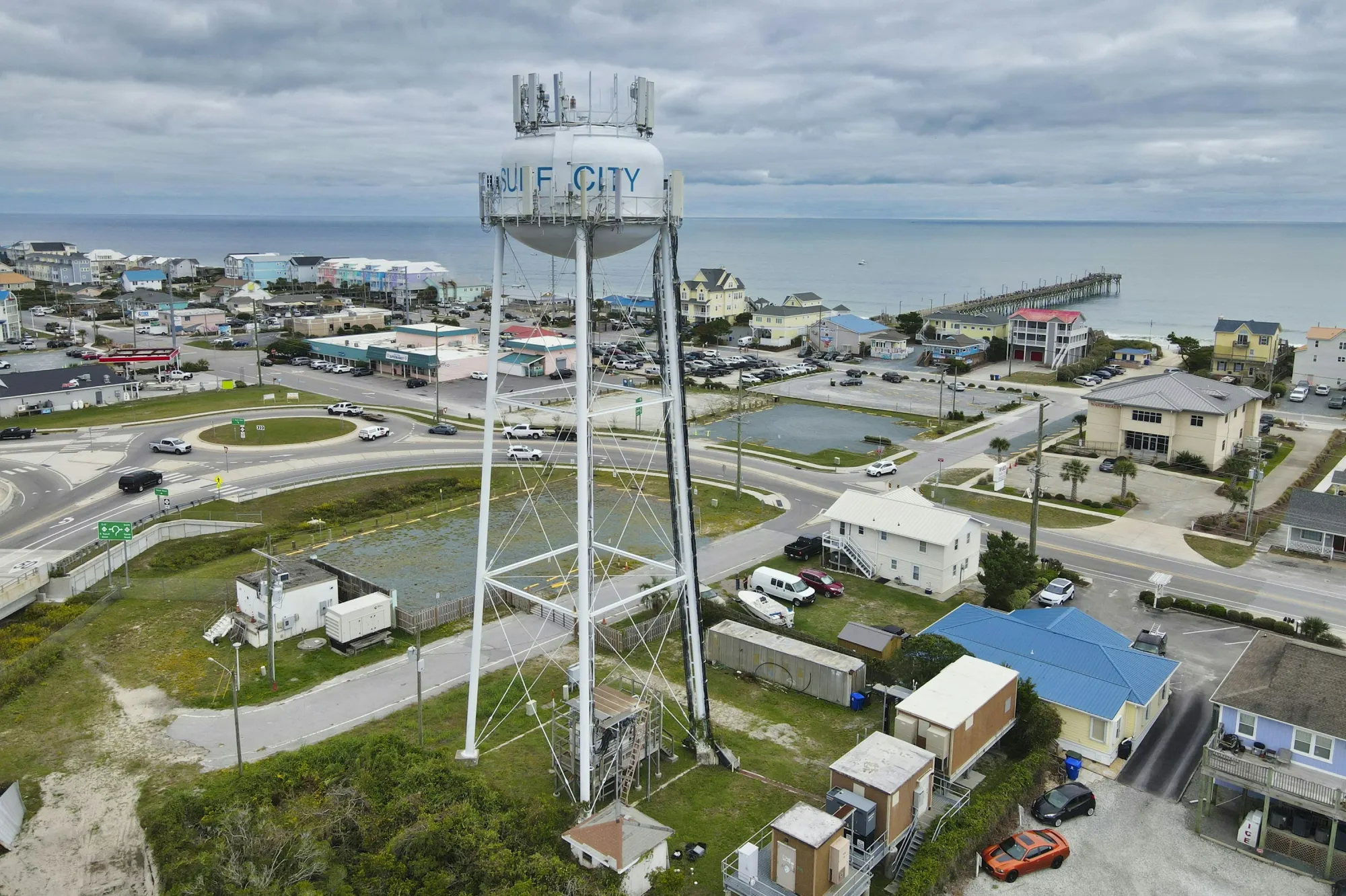 Drone view of the Surf City water tower with the fishing pier in the background, North Carolina