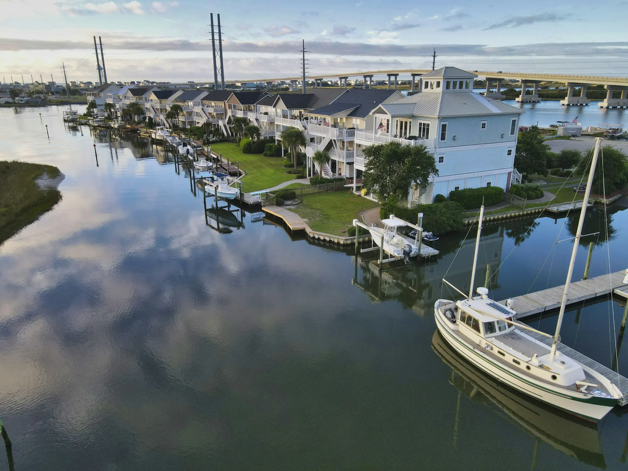 Waterfront homes and boat docks on the sound side of Surf City, North Carolina, at sunrise